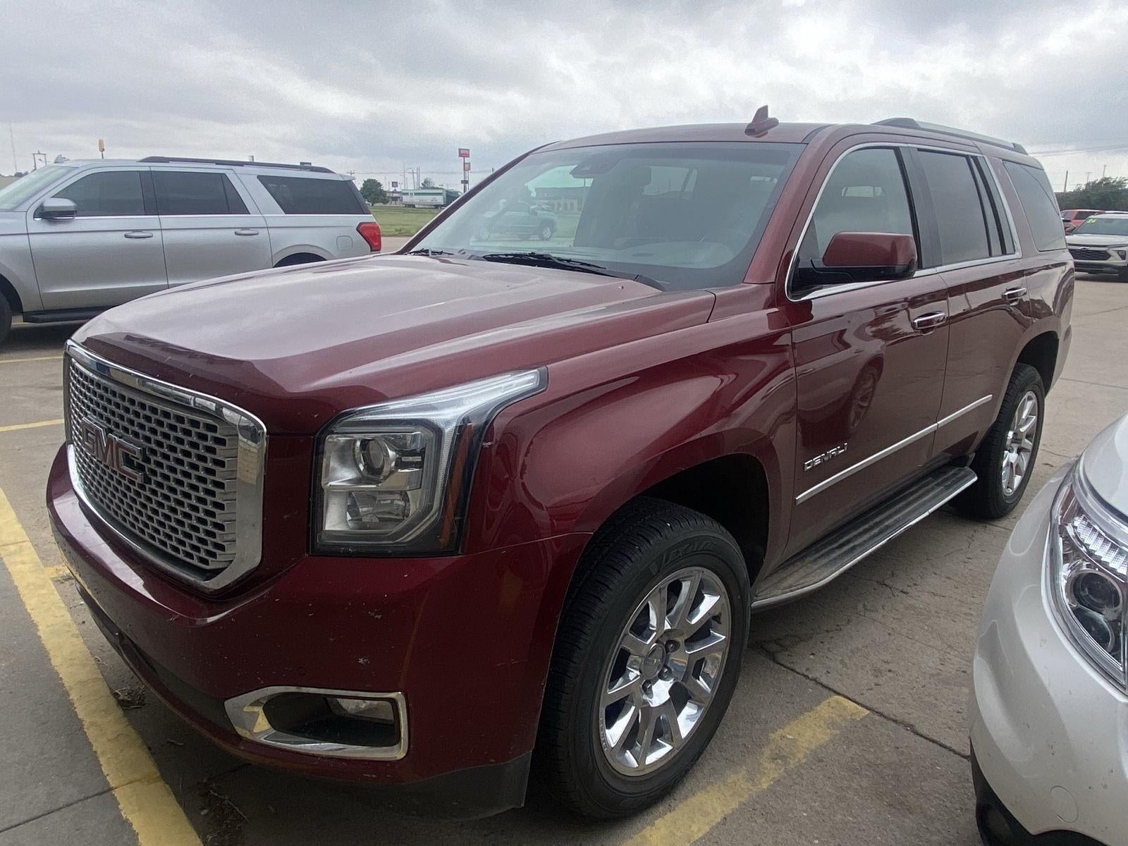 2016 GMC Yukon Denali in Crimson Red Tintcoat — front three-quarter view