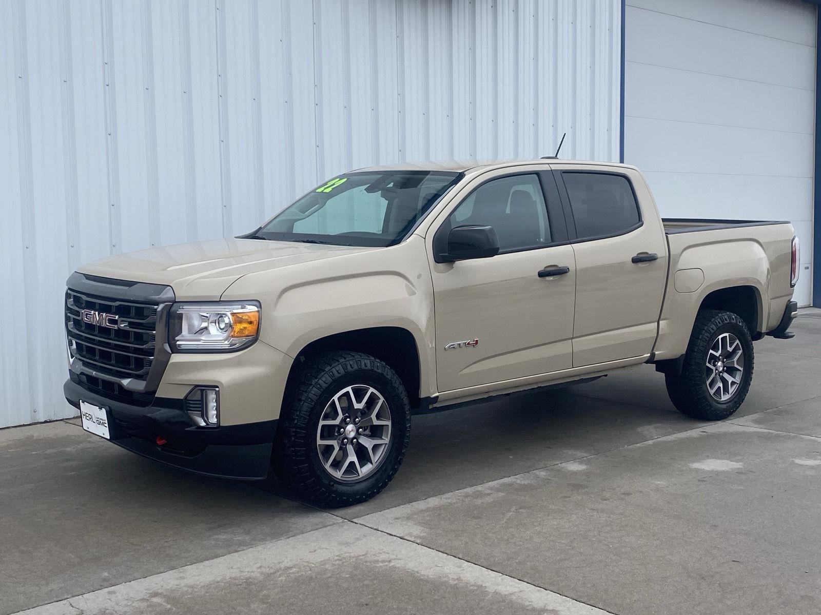 2022 GMC Canyon AT4 - Cloth in Desert Sand Metallic — front three-quarter view